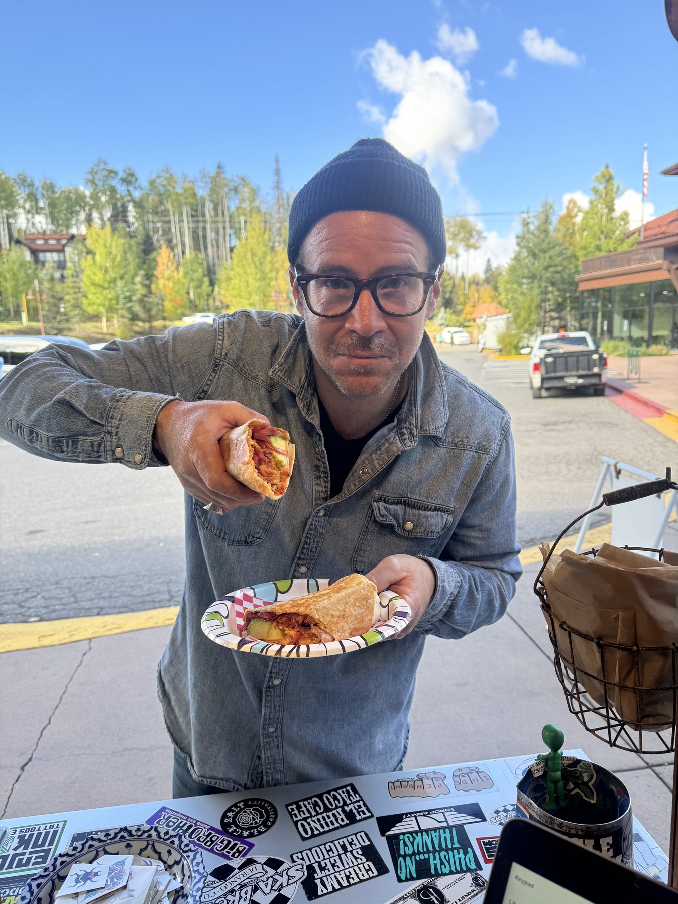 Cody holding a taco outside Taco El Rhino