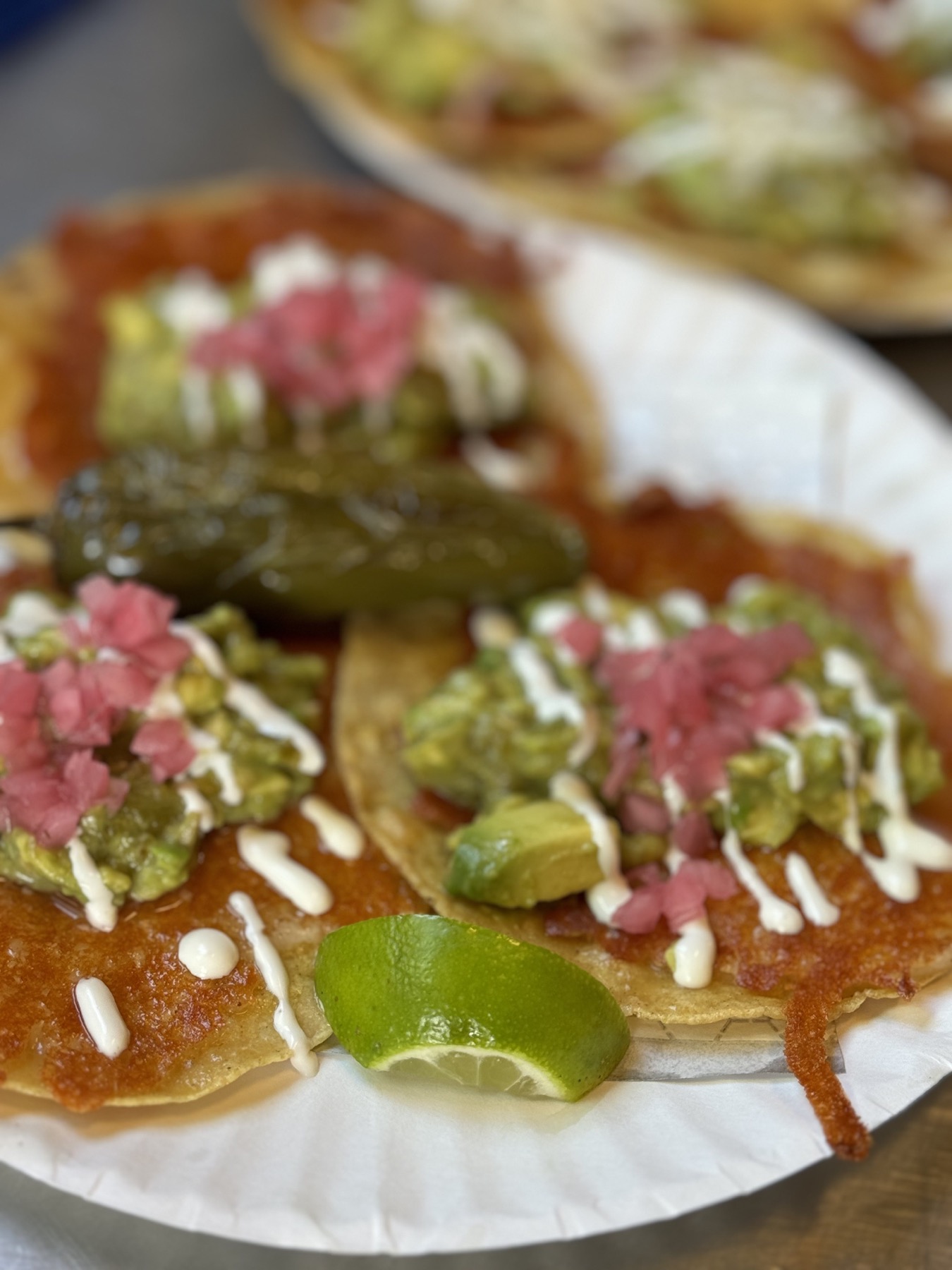 Crispy dorado tacos finished with avocado, crema, salsa and pickled onions