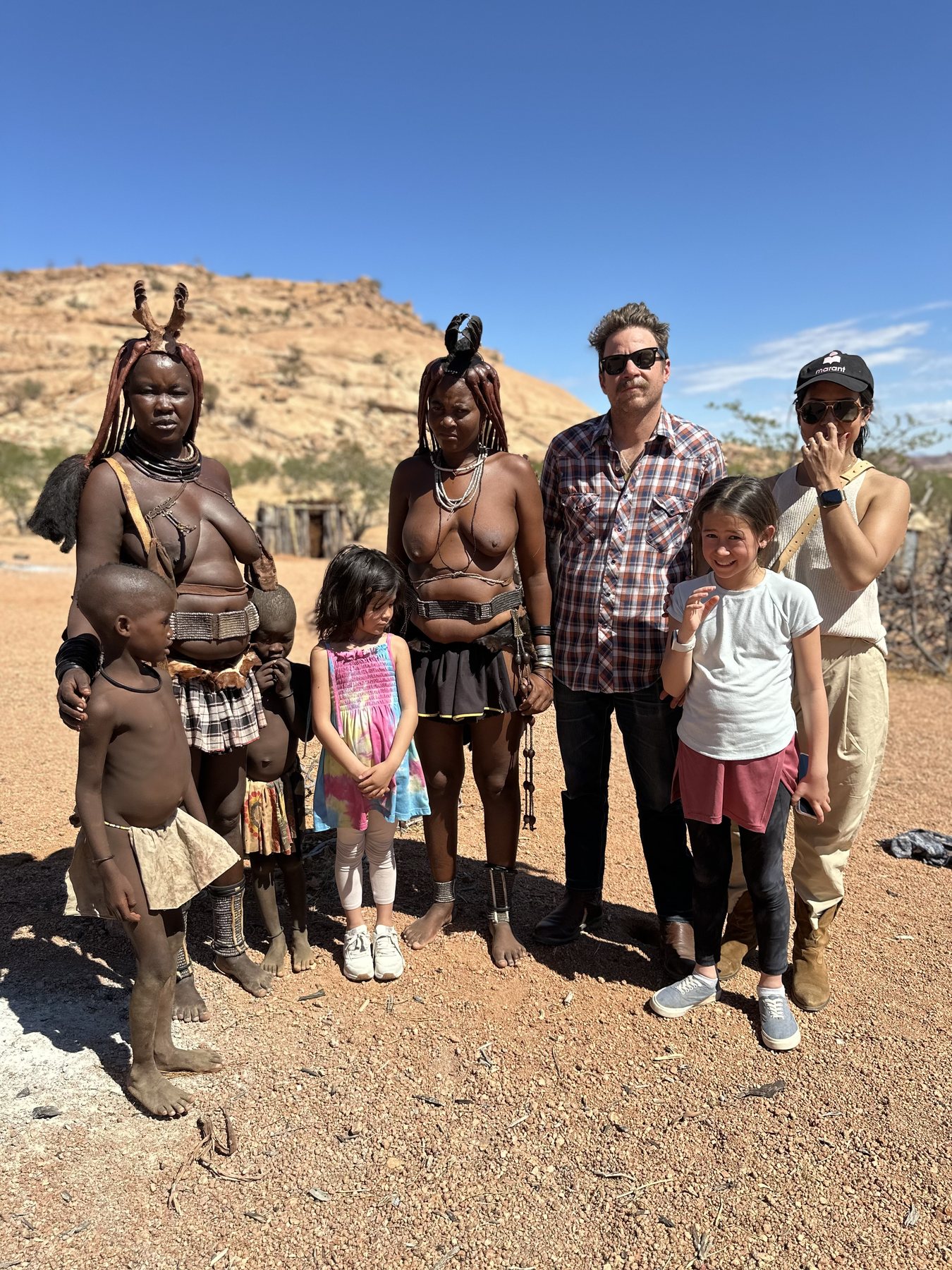 Cody’s family visiting with members of a Himba community in Namibia